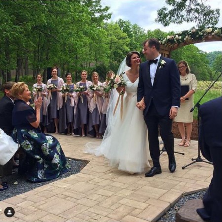 Kasie Hunt and Matthew Mario Rivera at their wedding after being pronounced husband and wife